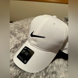 white, nike baseball cap. material is 100% polyester.